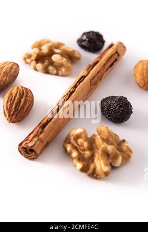 Assortment of nuts and cinnamon isolated on white background Stock Photo