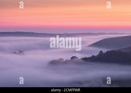 Dawn mist over Cranborne Chase from Win Green Hill, Wiltshire, England, UK Stock Photo