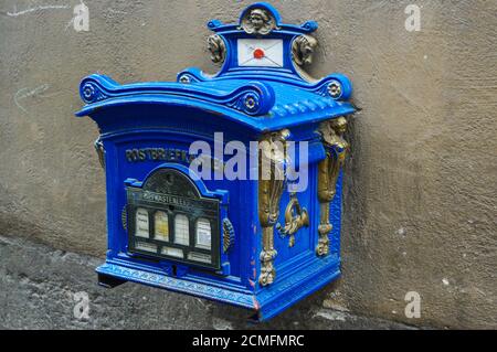 Blue old vintage postbox Germany, public mailbox still in use Stock Photo
