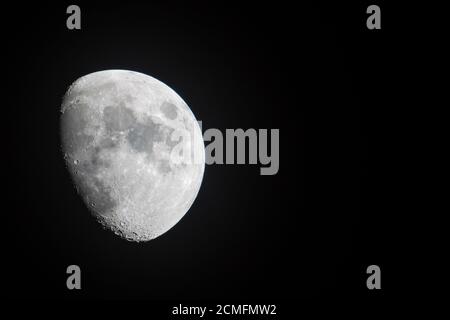 Half Moon Background / The Moon is an astronomical body that orbits planet Earth, being Earth's only permanent natural satellite Stock Photo