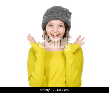 Portrait of laughing (happy) teen girl in a knitted hat and bright jersey. Stock Photo