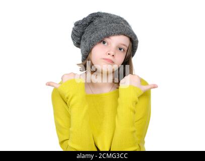 Portrait of cute teen girl showing her fingers in different directions. Stock Photo