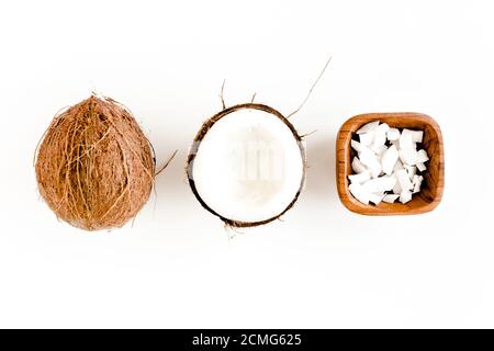 Pattern with coconuts and tropical palm leaves on white background. Tropical abstract background. Flat lay, top view. Stock Photo