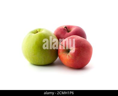 Two red and one green ripe apples on a white background. Stock Photo