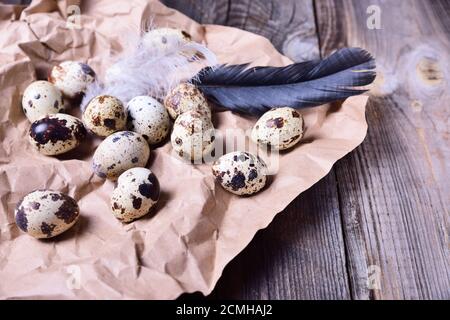 Group of quail raw eggs on brown kraft paper Stock Photo