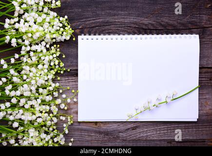 Notebook with clean white sheets on a wooden surface Stock Photo