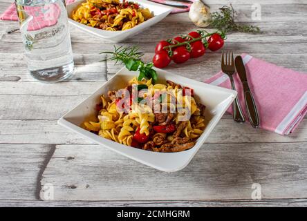 mediterranean dish with pasta, meat and vegetables on a plate Stock Photo