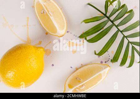 Lemons are on white watercolor paper with multi-colored spray paint. Stock Photo
