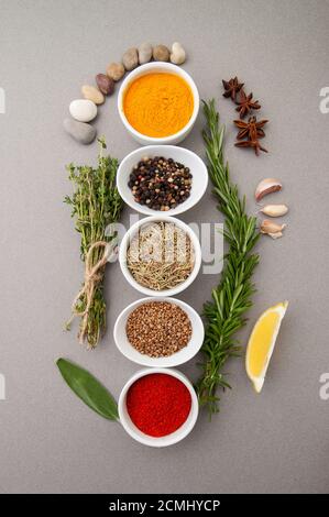 Various spices on a gray background. Stock Photo