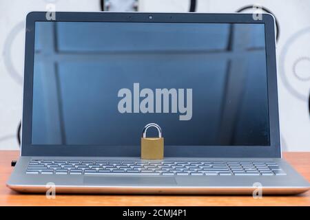 a locked padlock on a laptop computer, security concept Stock Photo
