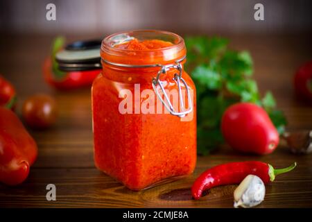 fresh natural homemade sauce made of peppers, tomatoes and other vegetables Stock Photo