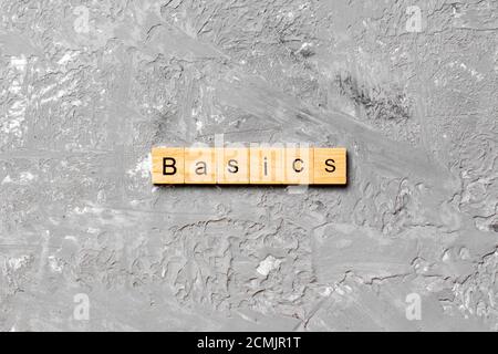 BASICS word written on wood block. BASICS text on table, concept. Stock Photo