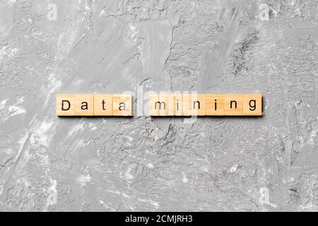 Data mining word written on wood block. Data mining text on cement table for your desing, concept. Stock Photo