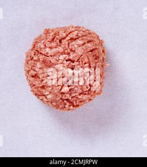 topshot of Raw meatballs in a studio setting, isolated on white. Stock Photo