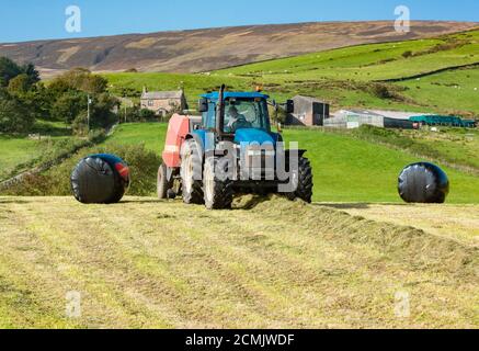 Chipping, Preston, Lancashire. UK. 17th Sep 2020.  A day of glorious weather giving perfect conditions for baling a second cut of silage at Chipping, Preston, Lancashire. Credit: John Eveson/Alamy Live News Stock Photo