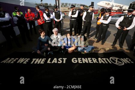 Climate change activists attend an Extinction Rebellion protest outside Heathrow Airport in London, Britain April 19, 2019. REUTERS/Simon Dawson