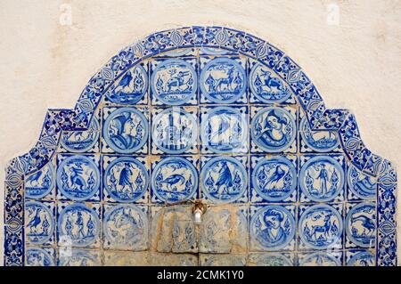 Blue tiles decorating an ornamental fountain in the Alcazar of Seville, Spain Stock Photo