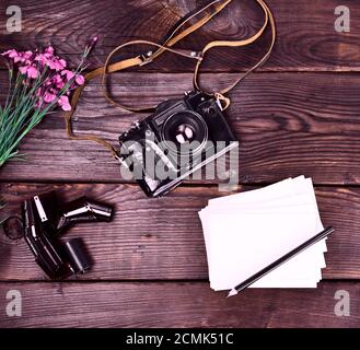 Old vintage film camera in a leather case Stock Photo