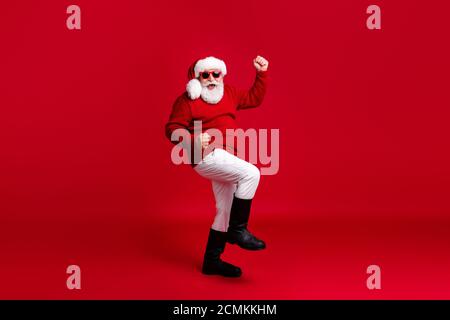 Full size photo of crazy old man in santa claus headwear raise fists win shopping season fairy x-mas sale wear pants trousers boots isolated over Stock Photo