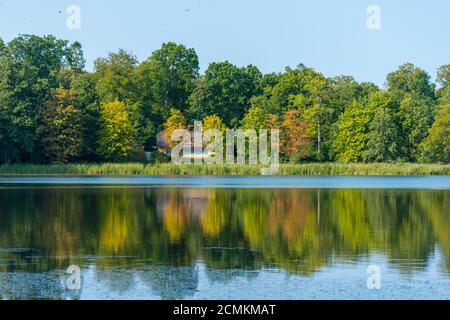 Traditional farm building on the shore of Castle Lake of Royal Palace Gråsten or Gravenstein, Flensburg Fjord, Denmark, Jutland, Northern Europe, Stock Photo