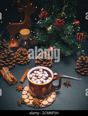 hot chocolate with marshmallows in a brown mug on a black background Stock Photo