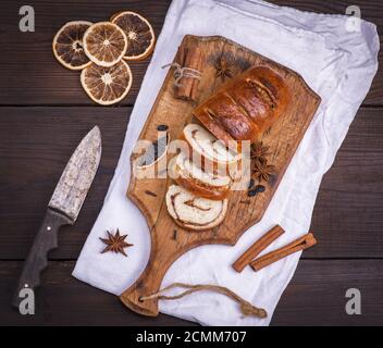 baked roll with cinnamon and nuts Stock Photo