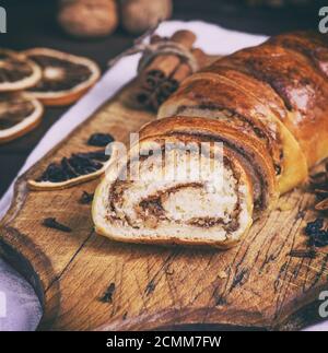baked roll with cinnamon and nuts Stock Photo