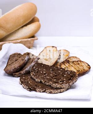 a variety of pieces of bread on a white napkin Stock Photo