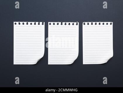 three blank white paper sheets torn from a notepad Stock Photo