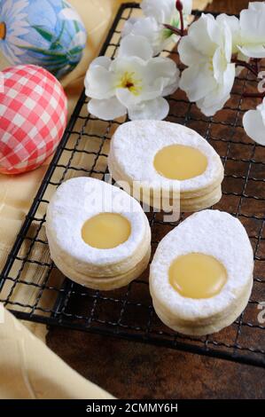 delicate, melting in the mouth a homemade Easter biscuit made from sand in the form of an egg with a Stock Photo