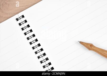 Empty notebook with pen on desk close-up Stock Photo