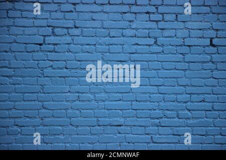 Old brick wall painted into solid blue Stock Photo