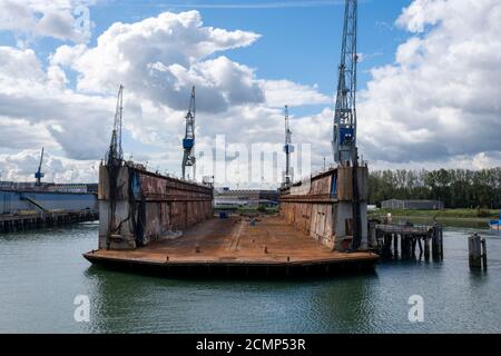 Rotterdam, The Netherlands Eye level view on an empty floating dry dock with large cranes on the side Stock Photo