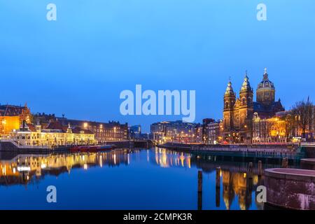 Amsterdam Netherlands, night city skyline at Basilica of Saint Nicholas Stock Photo