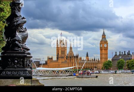 London, UK, 2015.  Houses of Parliament and Big Ben on the River Thames with various tourist boats which are used to take tourists up the Thames Stock Photo