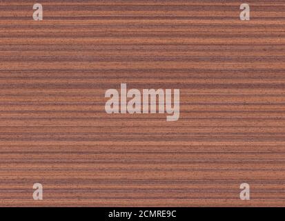 Golden brown wood veneer. Brown wood with strong stripes. Probably eucalyptus wood. Intended as a background. Stock Photo