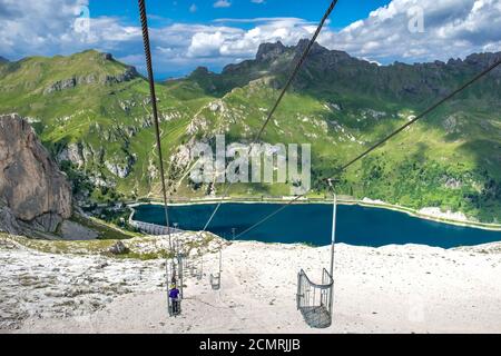 Fedaia Lake and the old cableway to the Marmolada Glacier in the Italian Dolomites. South Tyrol Italy. Europe Stock Photo