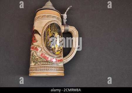 Ceramic mug, budweiser with the inscription King of Beer in relief, on a black background, used for drinking beer, top view Stock Photo