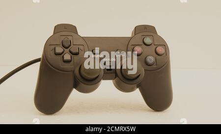 Joystick, black color game controller with controllers, with multiple buttons, used in computer video games, simulators and notebook, white background Stock Photo