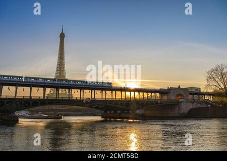 Paris France city skyline sunrise at Eiffel Tower and Seine River with Pont de Bir-Hakeim bridge and Stock Photo