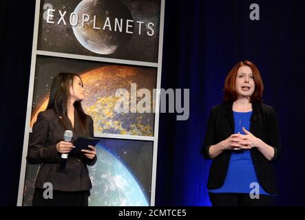 Space Telescope Science Institute astronomer Nikole Lewis (R) makes remarks as NASA Public Affairs Officer Felicia Chou listens, during a news conference to present new findings on exoplanets, planets that orbit stars other than Earth's sun, in Washington, U.S., February 22, 2017.                             REUTERS/Mike Theiler