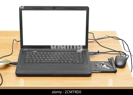laptop on a table with an open drive isolated on white background Stock Photo