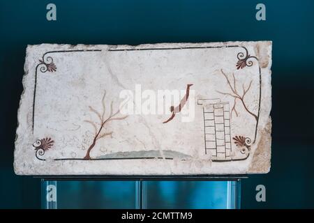 Paestum, Italy - August 25 2020: Tomb of the Diver or Tomba del Tuffatore, Cover Slab with fresco, an Arteact of Magna Graecia Stock Photo