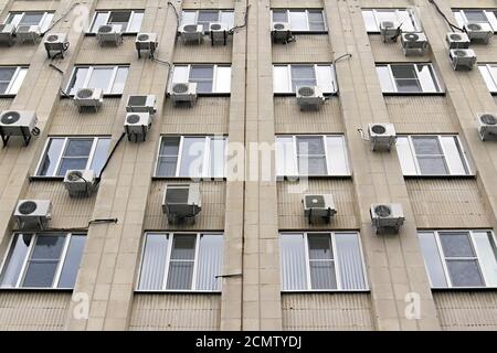 mani air conditioners on the  wall of office building Stock Photo