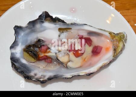 Oyster with red wine shallot vinegar They are bivalve molluscs of species native and Pacific rock oysters The beds are directly offshore in Whitstable Stock Photo