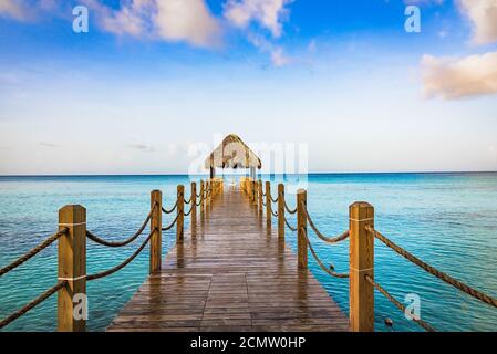hot tropical day the Caribbean sea pier with pergola Stock Photo