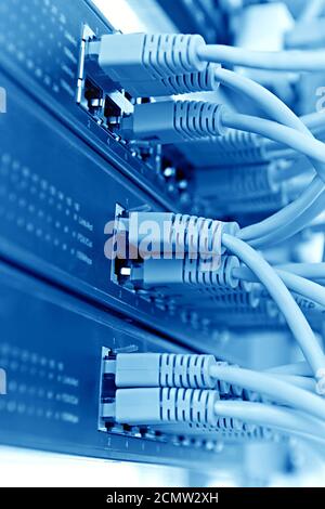 Patch Panel server rack with  cords in the background Stock Photo