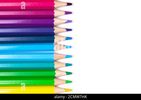 multicolored wooden pencils in rainbow shades in line on a white isolated background mock up, horizontal Stock Photo