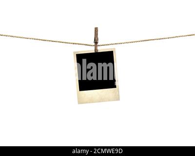 Old style photo  hanging on a clothesline isolated on white background Stock Photo