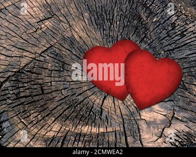 two red paper hearts on a grungy wooden background Stock Photo
